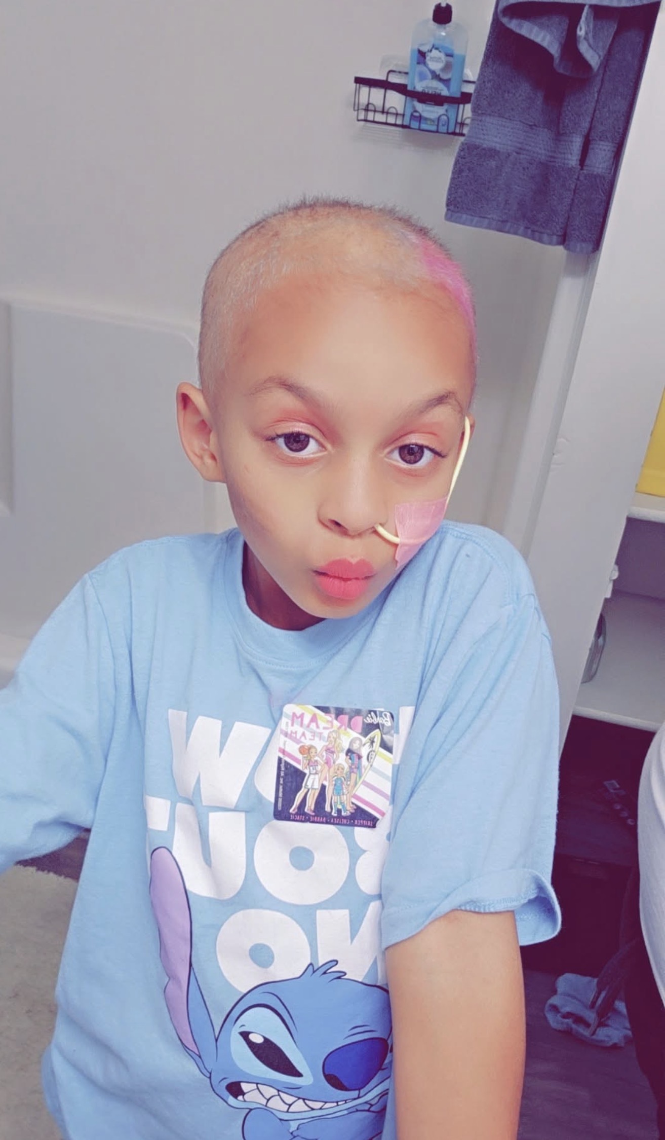 Hero Jazlynn Davis smiling in a Gamerosity superhero cape